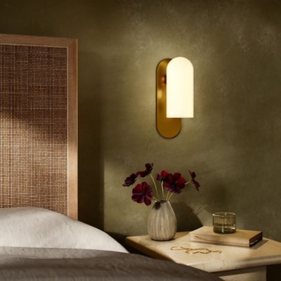 Shown in Burnished Brass finish, Opal Matte shade color, Medium size, lit, in use
