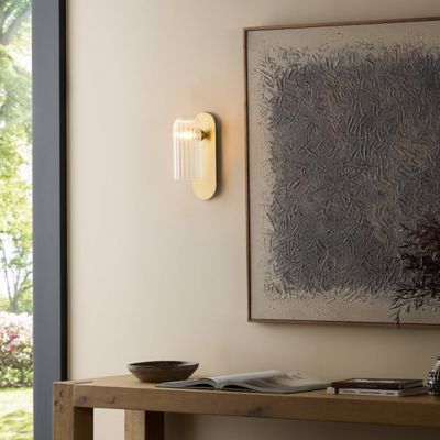 Shown in Burnished Brass finish, Clear Ribbon shade color, Medium size, in use, lit