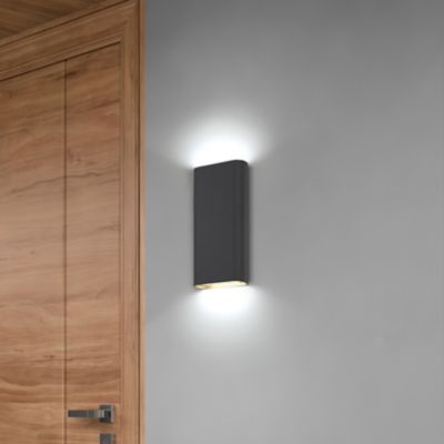 Directional wall outlet sconce