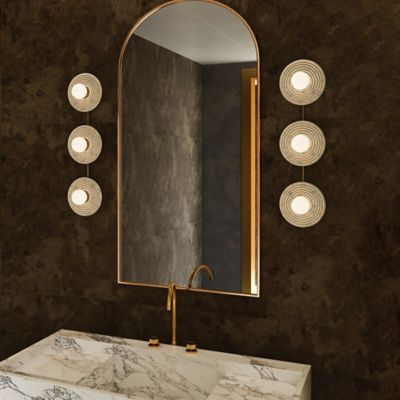 Shown in Vintage Brass with Alabaster finish, 3 light, lit, in use