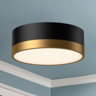 Shown in Aged Gold with Matte Black finish, Small size, lit, in use