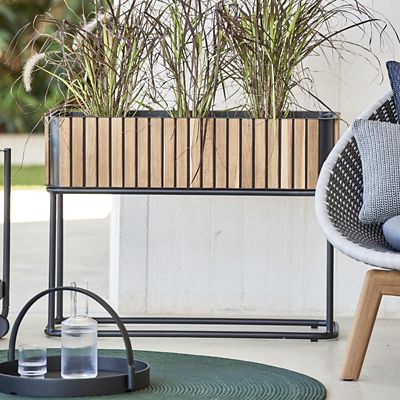 Shown in Teak with lava grey color, in use