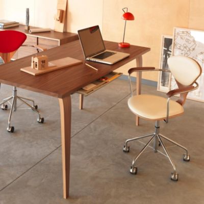 Shown in Walnut: Natural Frame finish, Vincenza Leather: 2122 upholstery, in use