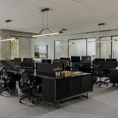 Shown in Brushed Brass finish, Dark Stained Walnut, 64-Inch size, in use