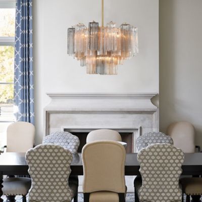 Shown in Aged Brass finish, Autumn shade color, 9 lights, in use, lit