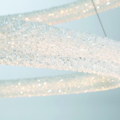 Shown in Chrome finish, Medium size, Detail view, lit