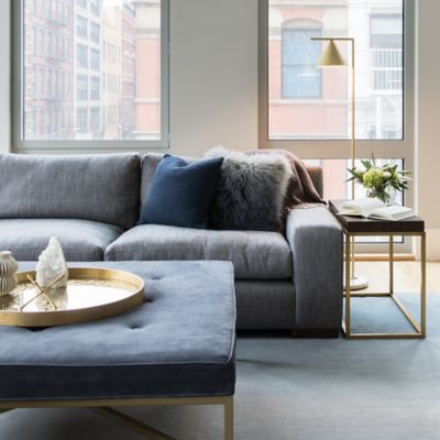 Shown in Brass with White Carrara Marble Base finish, in use, lit