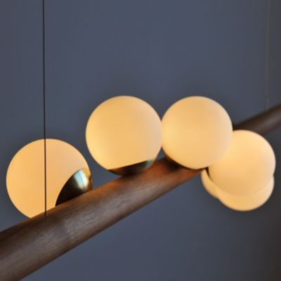 Shown in Brass finish, Walnut wood finish, In Detail