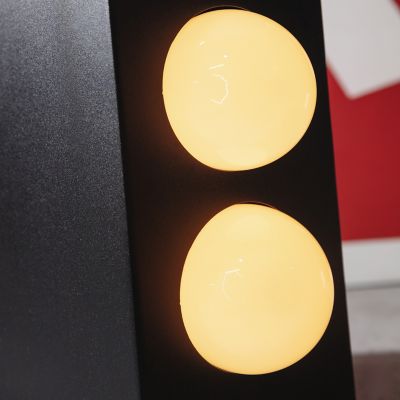 Shown in Black finish, detail view, lit