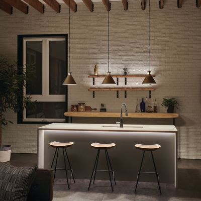 Shown in Natural Brass finish, in use, lit