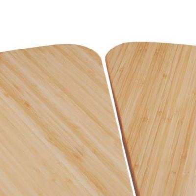 Close-up of light wood table segments showing grain and edge profile.