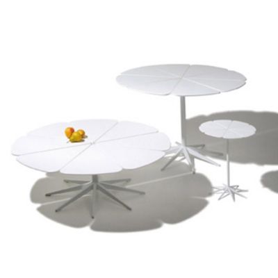 White dining table set with modern white side tables on a white background.
