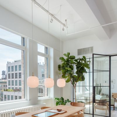 Shown in Brushed Brass finish, Opal shade, in use