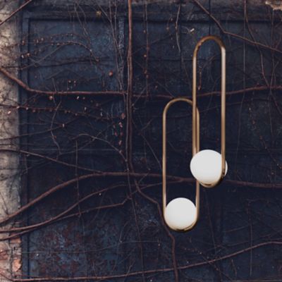Shown in Brushed Brass finish, Small Size, in use, lit