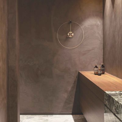 Shown in Brass with Walnut color, in use