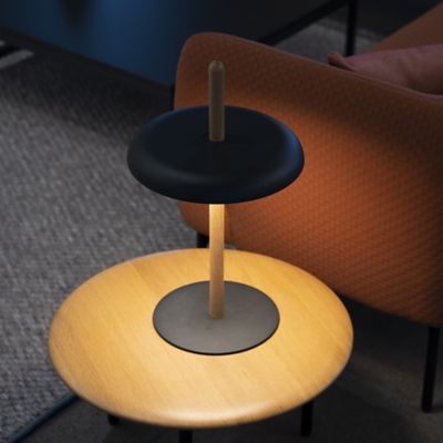Shown in Oak finish, Black Shade color, in use, lit