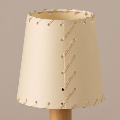 Shown in  Stitched beige parchment Color, Detail view, lit