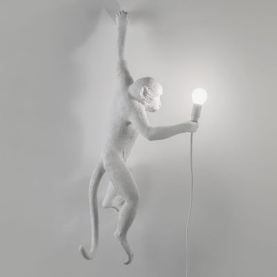 Monkey deals wall sconce