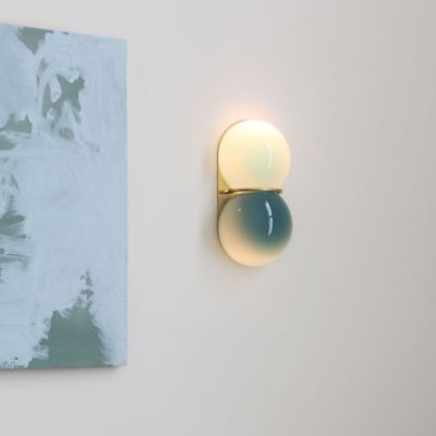 Shown in Celadon / New Blue Glass color, Brushed Brass finish, in use