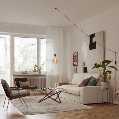 Shown in Graphite finish, Plug In Installation, Medium size, in use, lit