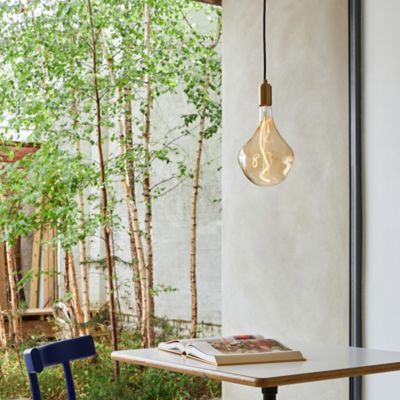 Shown in Brass finish, Hardwired Installation, Large size, lit, in use