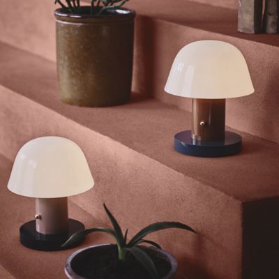 Shown in Nude and Forest finish, in use, lit